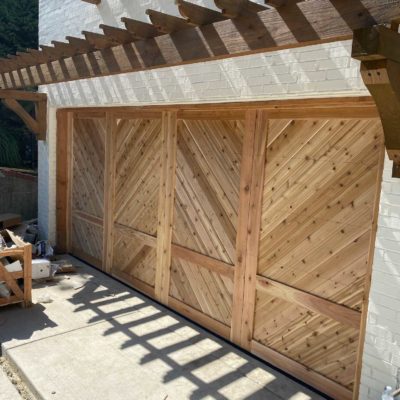 16x8 wood chevron garage door with white brick