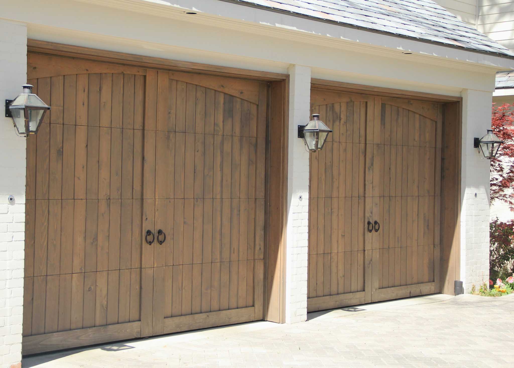 8x7 vertical panel wood garage door with eyebrow trim and knocker hardware