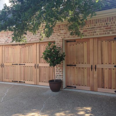 Clear Heart Cedar Garage Door with Decorative Hardware and Clavos