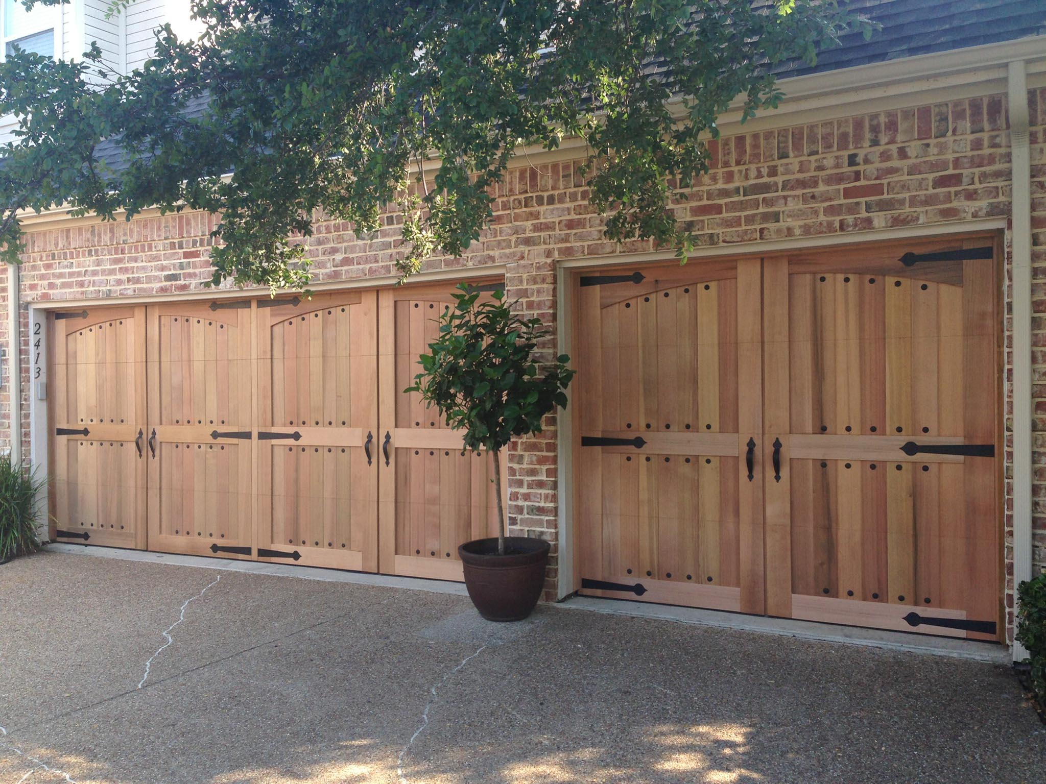 Clear Heart Cedar Garage Door with Decorative Hardware and Clavos