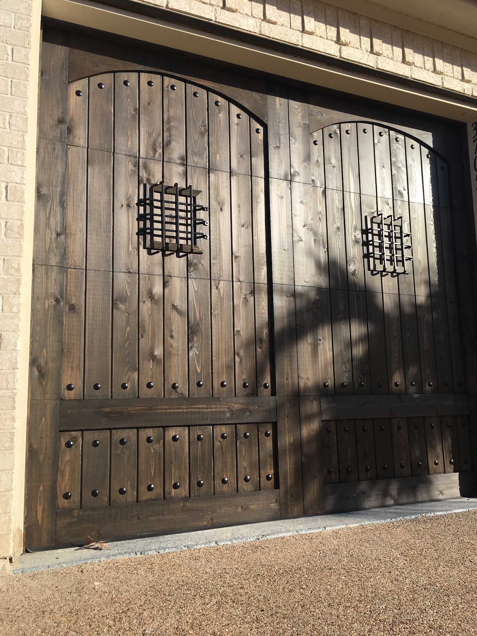 mediterranean wood garage doors with hardware