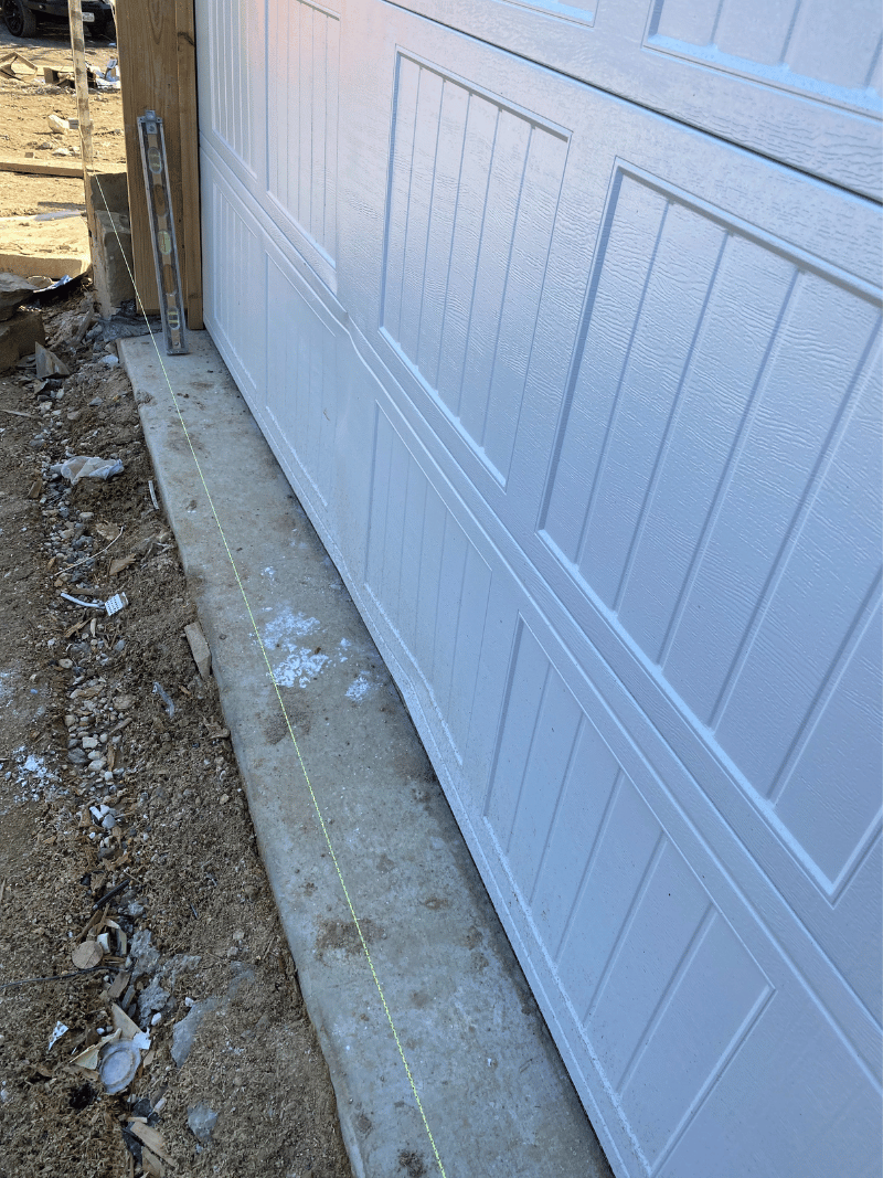 damaged bottom steel door section