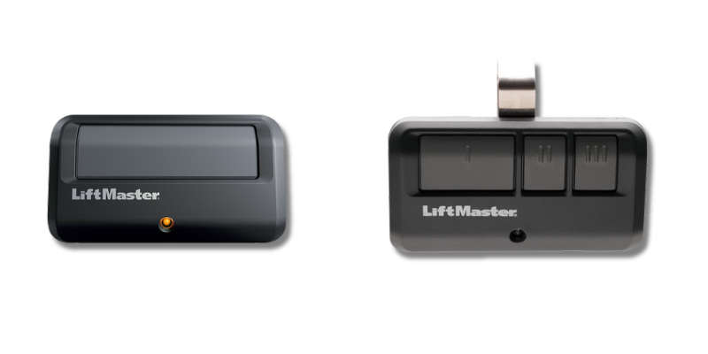 Two garage door clickers. The one on the left is a LiftMaster clicker with one button, the clicker on the right is a LiftMaster with three buttons.