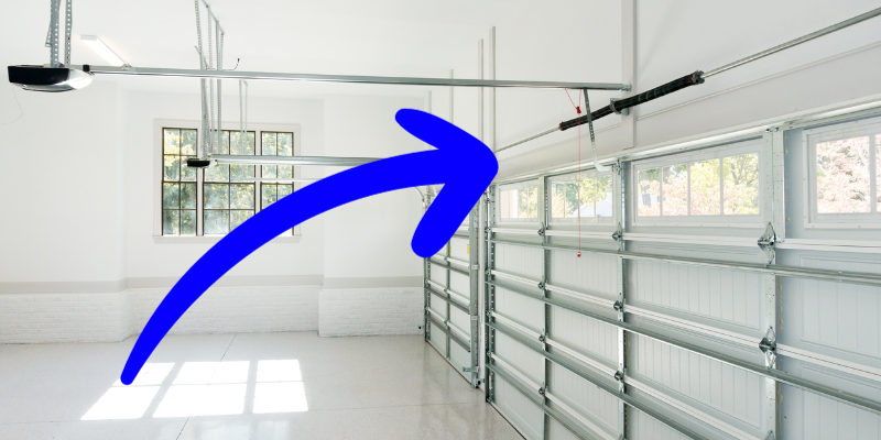 Interior view of garage doors with arrow pointing to door framing or door padding.