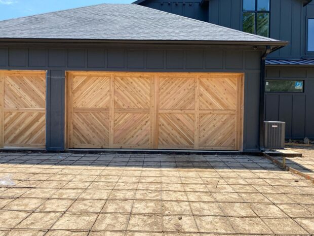 four square cedar chevron garage door on a black house