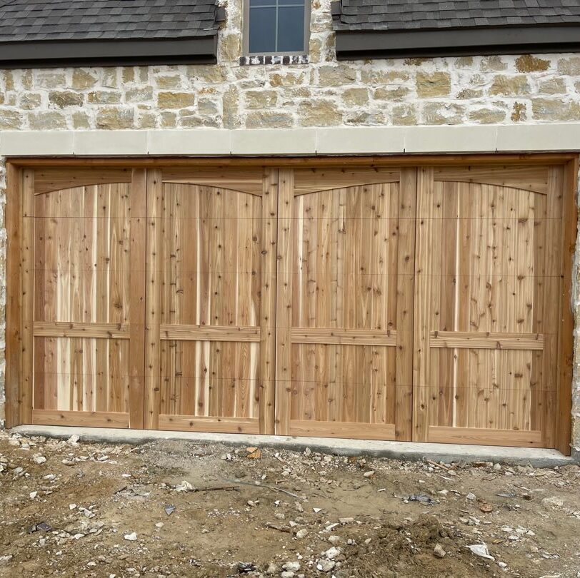 real wood cedar garage door with eyebrow trim