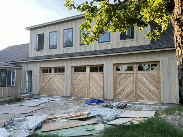 three 9x8 cedar chevron garage doors with glass top sections