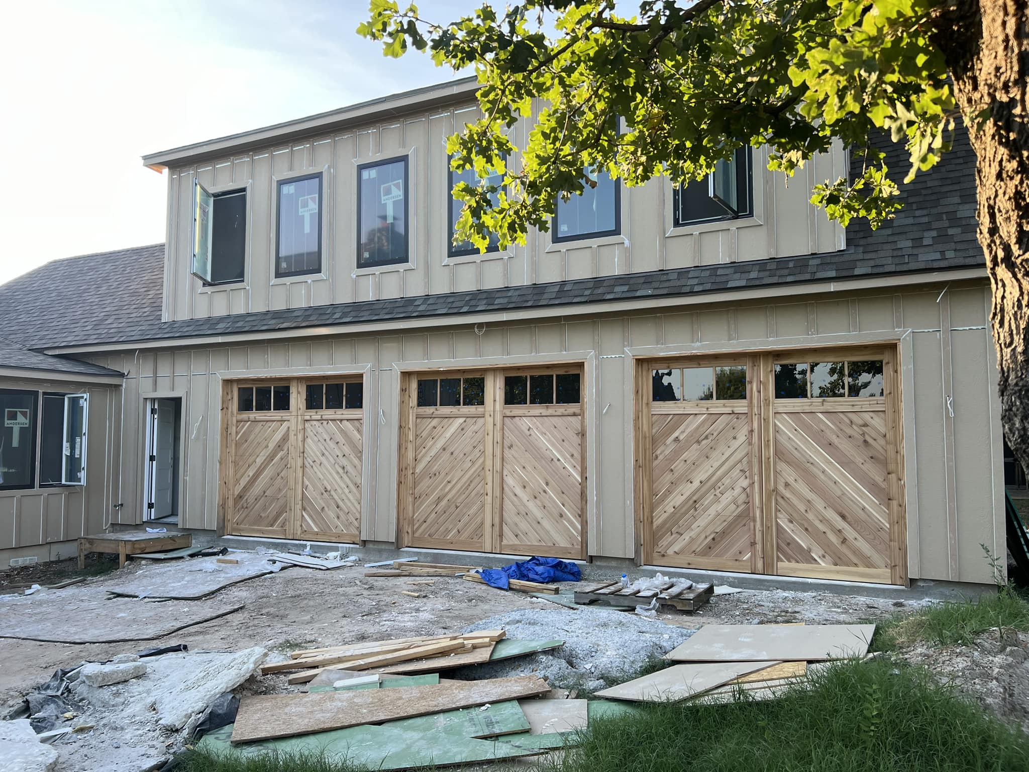three 9x8 cedar chevron garage doors with glass top sections
